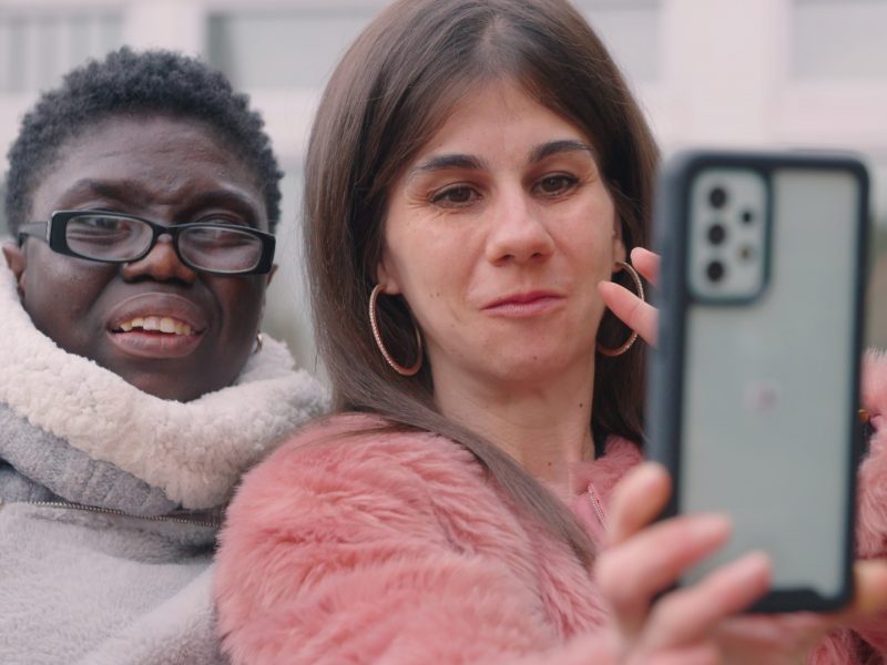 Two women taking a selfie on a mobile phone