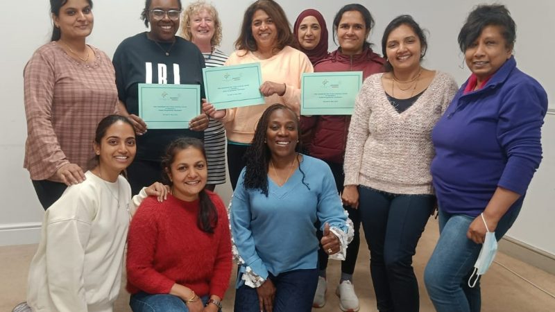 A groupf of people posing with their certificates from the Diabetes for South Asians course