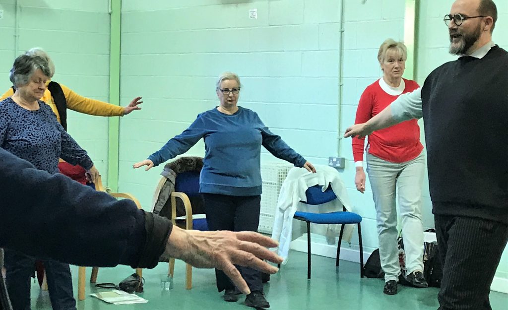 Participants warm up at Attic Theatre Company Going for a Song Workshop