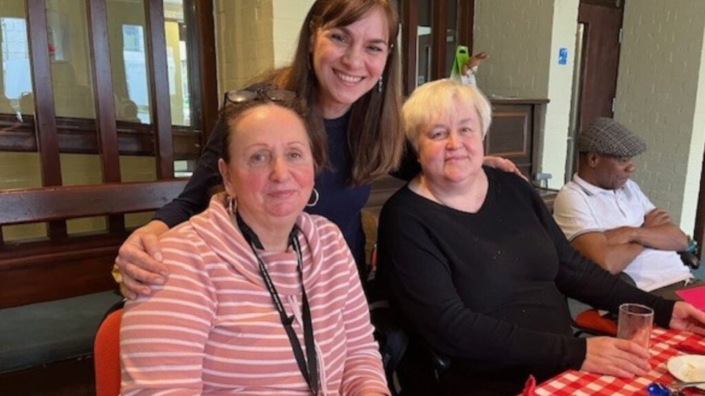 Women of Wandsworth intergenerational project, Senia Dedic from the project (centre) with group members having tea