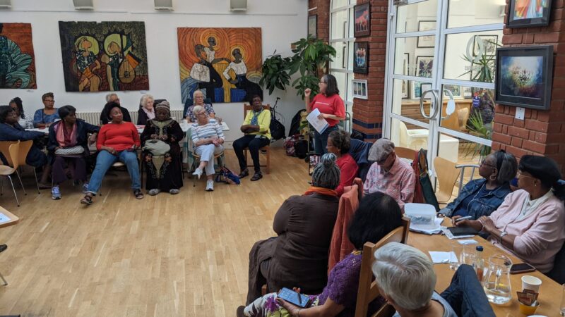 A group of local residents sitting together during a workshop.