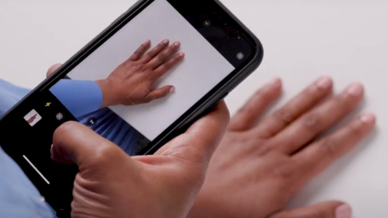 Somebody taking a photo of their hand