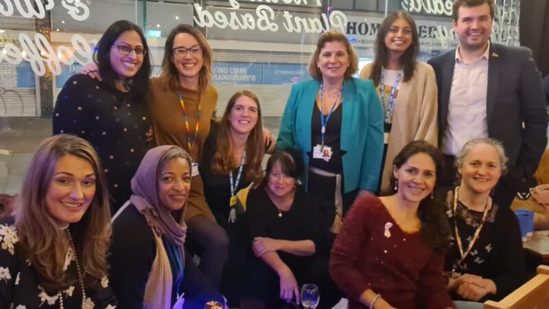 Group of people standing and sitting