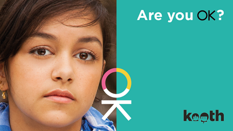 Image of a young woman with the text "Are you OK?"