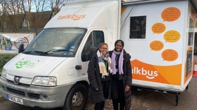 Jess, Community Outreach Worker, and Una, Senior Outreach Worker, standing in front of the Croydon Drop In Talkbus