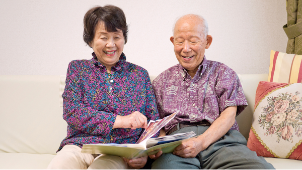An elderly couple from Croydon read a book together