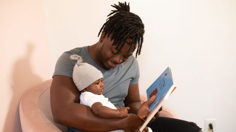 Father reading with baby