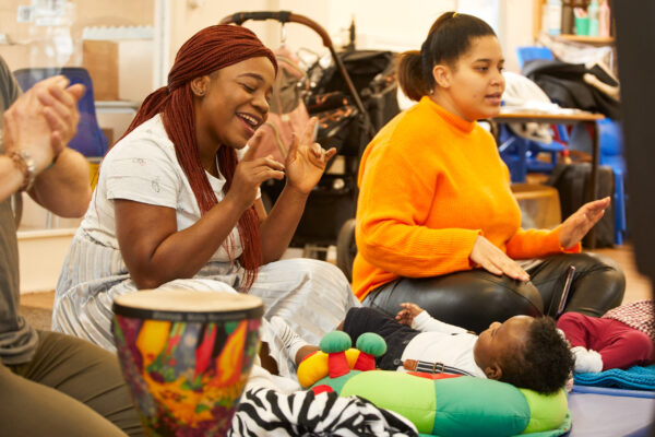 Mums and babies singing and clapping in Breathe Melodies for Mums session