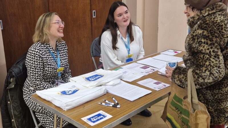 A Kingston carer chats with the Kingston Hospital team at a recent Carer's One Stop Shop