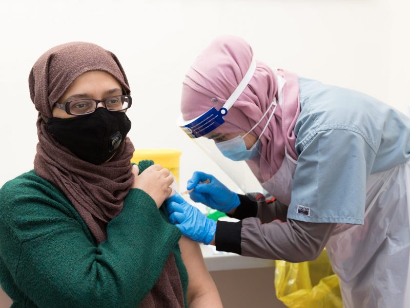 A Croydon resident getting her Covid vaccination at Croydon Mosque