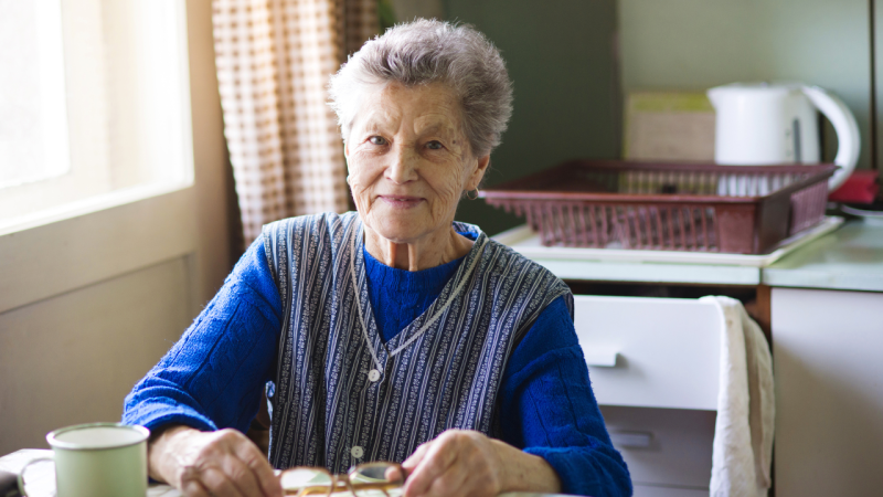 Older woman sitting at a table