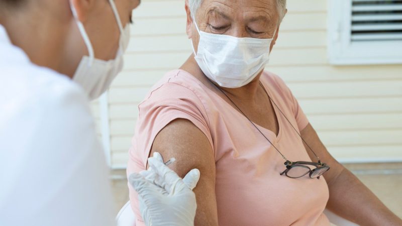 Shingles - older person receives a vaccine